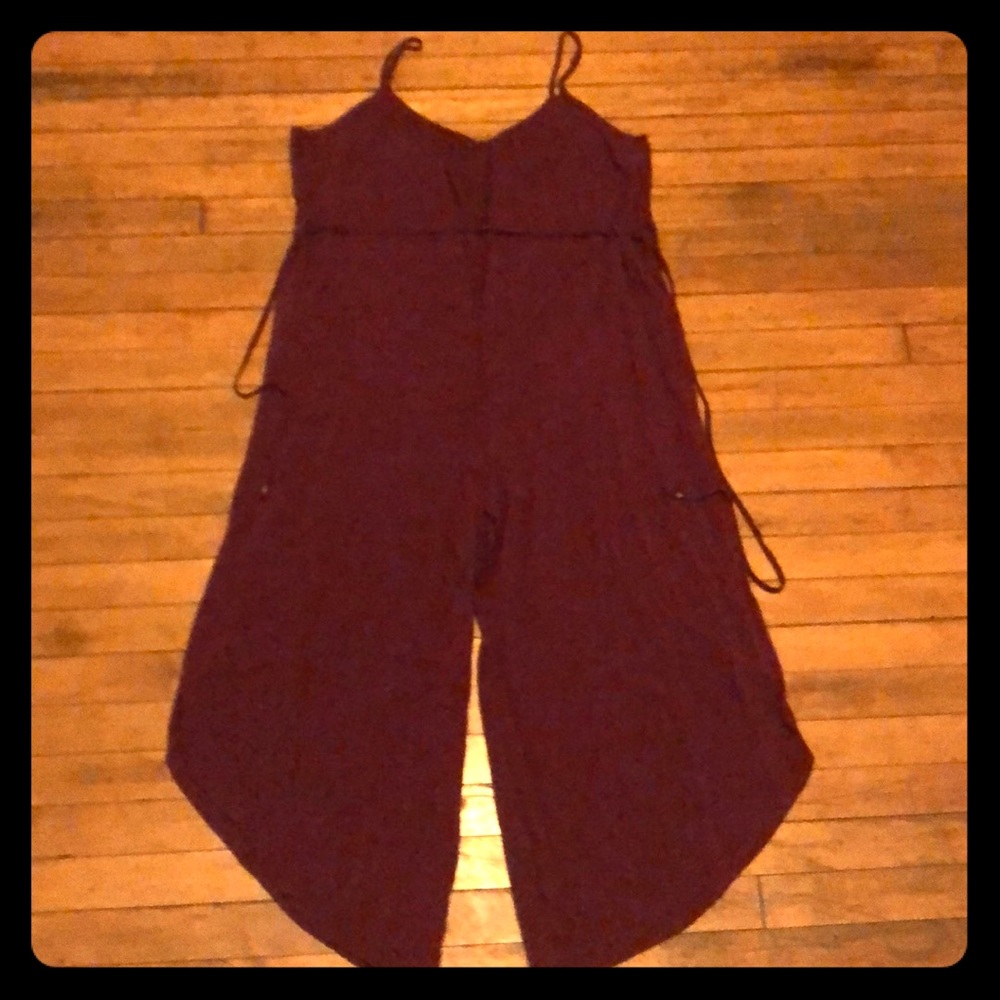 Magenta jump suit.